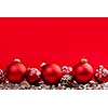 Red and silver Christmas decorations on crimson background