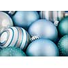 Close up of several blue Christmas glass baubles