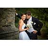 Beautiful, happy, younf wedding couple in a splendid historic castle environment, walking up the stairs, shining with happiness