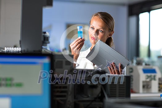 Portrait of a female researcher doing research in a lab (shallow DOF; color toned image) Portrait of a female researcher doing research in a lab (shallow DOF; color toned image)
