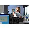 Portrait of a female researcher doing research in a lab (shallow DOF; color toned image)