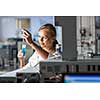 Portrait of a female researcher doing research in a lab (shallow DOF; color toned image)