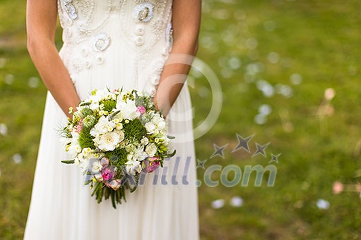 Lovely wedding bouquet in bride's hands