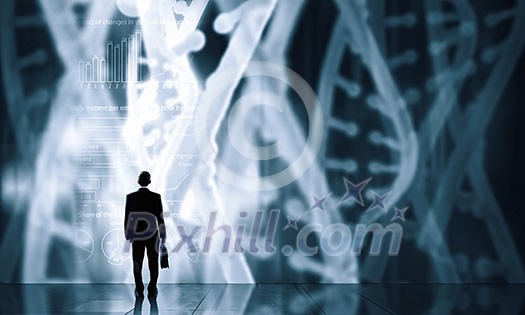 Businessman standing with back and virtual panel with dna spiral Businessman standing with back and virtual panel with dna spiral