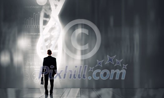 Businessman standing with back and virtual panel with dna spiral Businessman standing with back and virtual panel with dna spiral