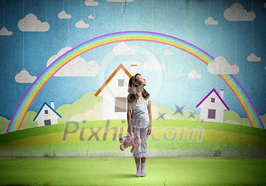 Cute girl wearing pajamas with toy bear in hand Cute girl wearing pajamas with toy bear in hand