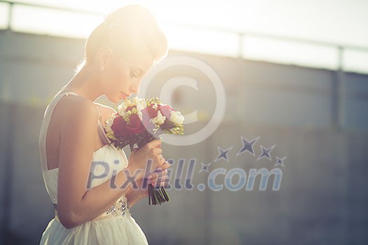 Gorgeous bride on her wedding day (color toned image; shallow DOF)