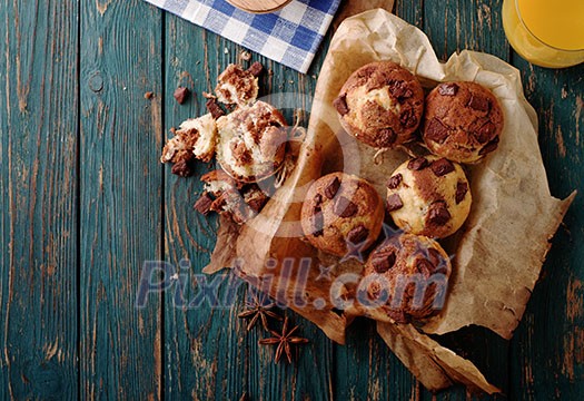 Homemade Tasty Chocolate muffins on the wooden table, rustic style. Homemade Tasty Chocolate muffins on the wooden table, rustic style.