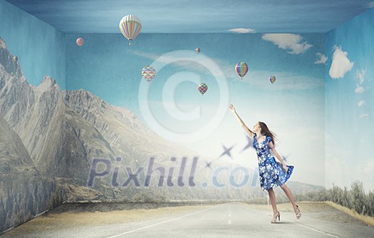 Young woman in summer dress flying in sky