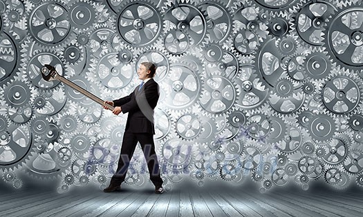 Young businessman fixing gears mechanism with wrench Young businessman fixing gears mechanism with wrench