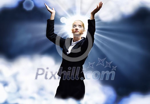 Young praying saint businesswoman with halo above head