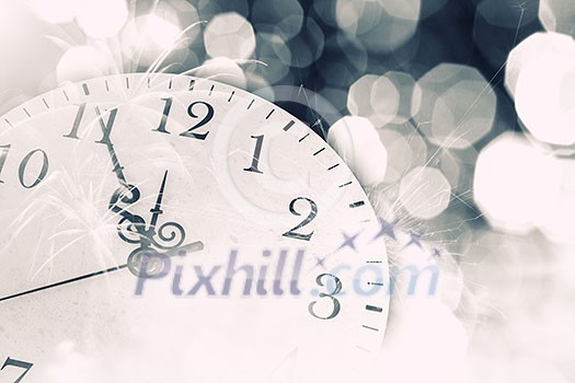 Conceptual image with pocket watch bokeh lights and fireworks
