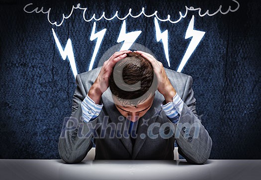 Troubled thoughtful businessman with hands on head Troubled thoughtful businessman with hands on head