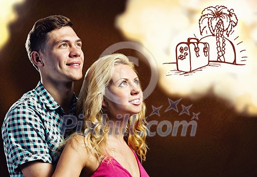 Young happy couple dreaming about future vacation Young happy couple dreaming about future vacation