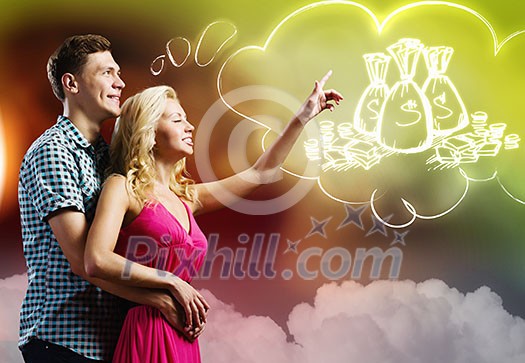 Young happy couple dreaming about family wealth Young happy couple dreaming about family wealth