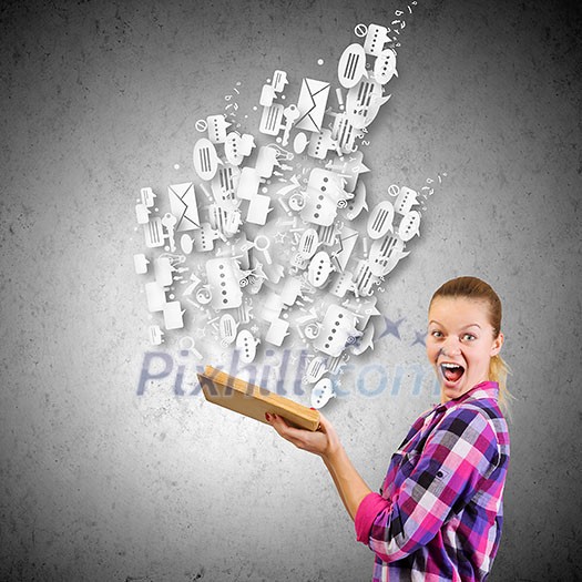 Young pretty woman in casual holding opened book Young pretty woman in casual holding opened book