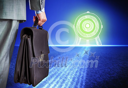 Rear view of businessman with briefcase and target Rear view of businessman with briefcase and target