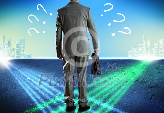 Rear view of uncertain businessman with briefcase Rear view of uncertain businessman with briefcase