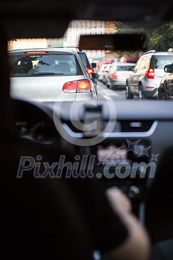 Traffic jam in a city with row of cars on the  road during rush hour