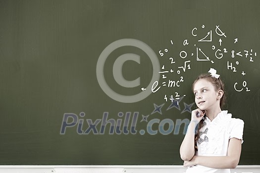 Kid student girl against school blackboard having good idea Kid student girl against school blackboard having good idea