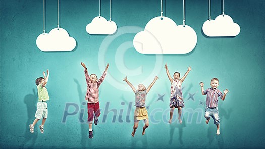 Group of children jumping high joyfully on colorful background