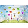 Group of happy children playing with colorful balloons