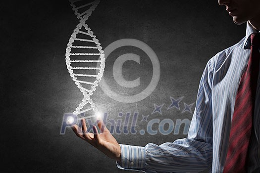 Hand of businessman holding dna molecule concept Hand of businessman holding dna molecule concept