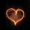 Glowing love heart symbol on dark background