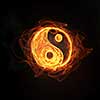 Glowing light Yin Yang sign in fire on dark background