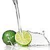Water splash on lime isolated on white