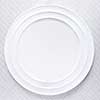 Empty white plate on tablecloth