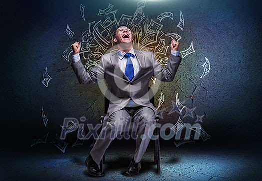 Joyful businessman sitting on chair under money rain
