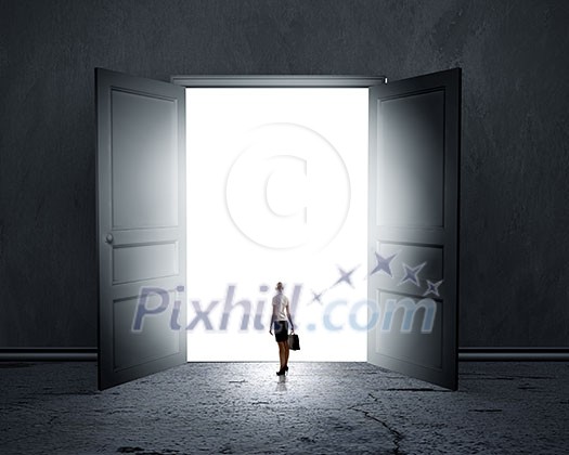 Silhouette of businesswoman standing in air gap Silhouette of businesswoman standing in air gap