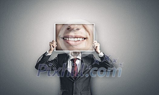 Businessman hiding head behind photo with huge mouth Businessman hiding head behind photo with huge mouth