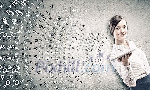 Young woman holding tablet pc in hands and letters flying around