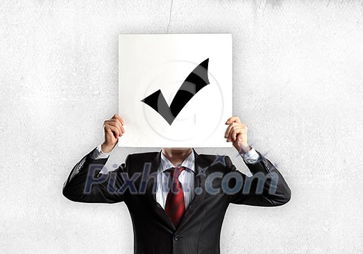 Businessman hiding his face with sheet of paper with sketches at background Businessman hiding his face with sheet of paper with sketches at background