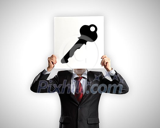 Businessman hiding his face with sheet of paper with sketches at background Businessman hiding his face with sheet of paper with sketches at background