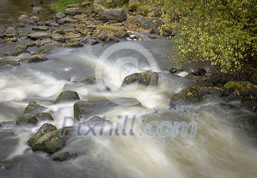 Flowing river scenery in september