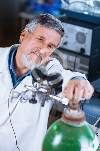 Senior male researcher carrying out scientific research in a lab (shallow DOF; color toned image) Senior male researcher carrying out scientific research in a lab (shallow DOF; color toned image)