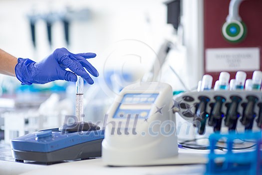 Hands of a female researcher doing research in a lab (shallow DOF; color toned image) Hands of a female researcher doing research in a lab (shallow DOF; color toned image)
