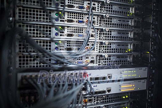 Server rack cluster in a data center (shallow DOF; color toned image) Server rack cluster in a data center (shallow DOF; color toned image)