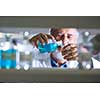 Senior male researcher carrying out scientific research in a lab (shallow DOF; color toned image)