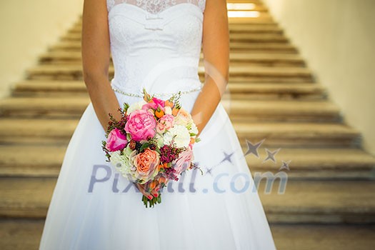 Lovely wedding bouquet in bride's hands