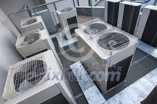 Air conditioning equipment atop a modern building - aerial/drone view of the roof with all the necessary installations Air conditioning equipment atop a modern building - aerial/drone view of the roof with all the necessary installations