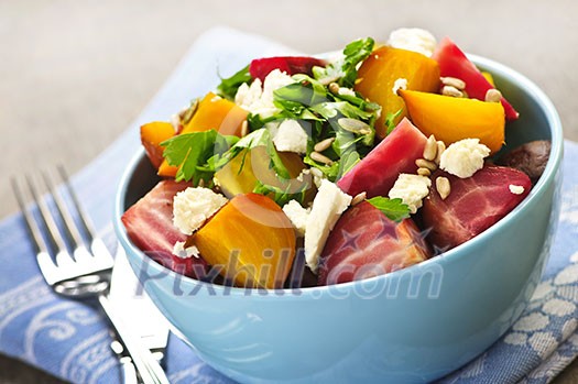 Bowl of roasted sliced red and golden beets