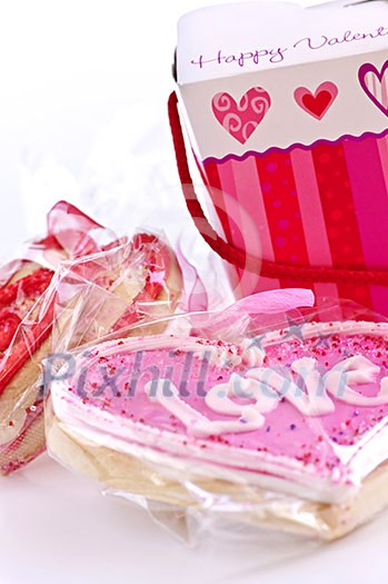 Homemade baked shortbread Valentine cookies with icing and gift boxes