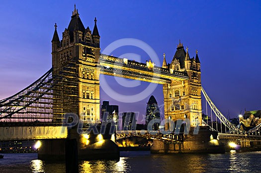 Tower bridge in London England at night over Thames river