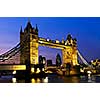 Tower bridge in London England at night over Thames river