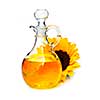 Sunflower oil bottle and flower isolated on white