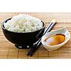 Rice bowl with soy sauce with chopsticks